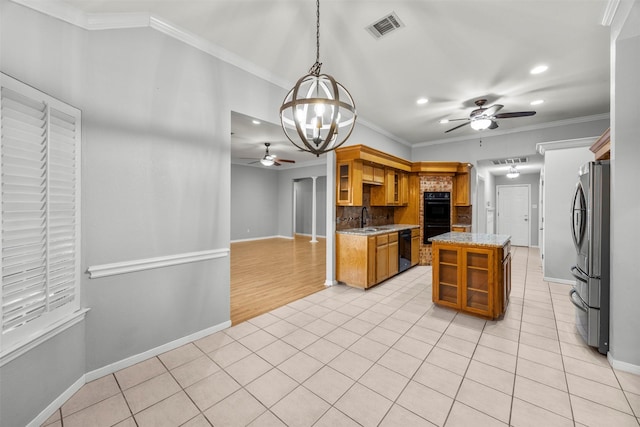 609 S Ruidoso Downs Dr, Robinson, TX 76706 - kitchen with recessed lighting, visible vents, a sink, ceiling fan with notable chandelier, and black appliances