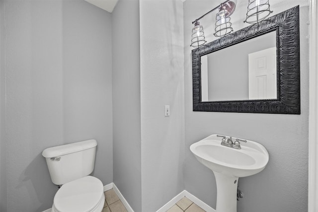 609 S Ruidoso Downs Dr, Robinson, TX 76706 - half bath featuring toilet, baseboards, and tile patterned floors