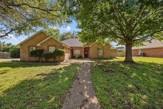 609 S Ruidoso Downs Dr, Robinson, TX 76706 - ranch-style house featuring a front lawn, brick siding, and fence