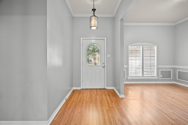 609 S Ruidoso Downs Dr, Robinson, TX 76706 - entrance foyer with crown molding, light wood-style flooring, and a healthy amount of sunlight