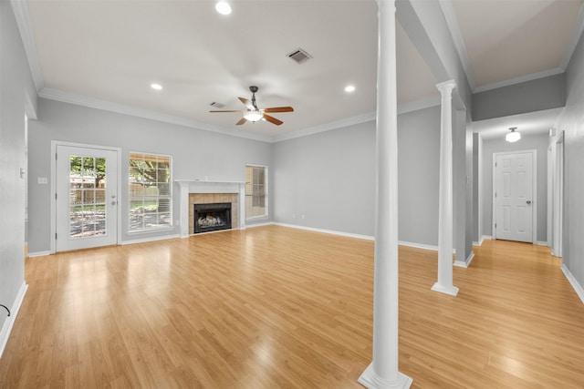 609 S Ruidoso Downs Dr, Robinson, TX 76706 - unfurnished living room with light wood-style flooring, a ceiling fan, ornate columns, visible vents, and baseboards