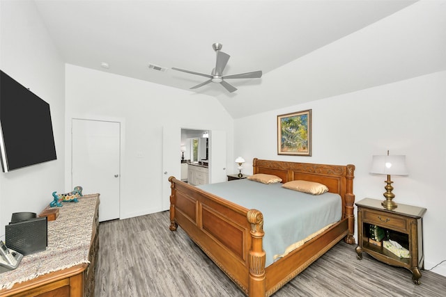 10110 Andre Dr, Irving, TX 75063 - bedroom featuring visible vents, ensuite bathroom, ceiling fan, light wood-style floors, and vaulted ceiling