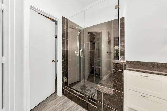 10110 Andre Dr, Irving, TX 75063 - full bathroom featuring a shower stall and wood finished floors