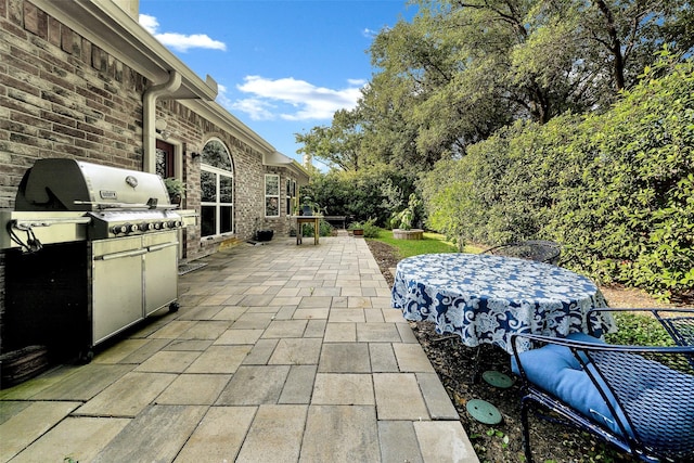 10110 Andre Dr, Irving, TX 75063 - view of patio featuring area for grilling and outdoor dining area