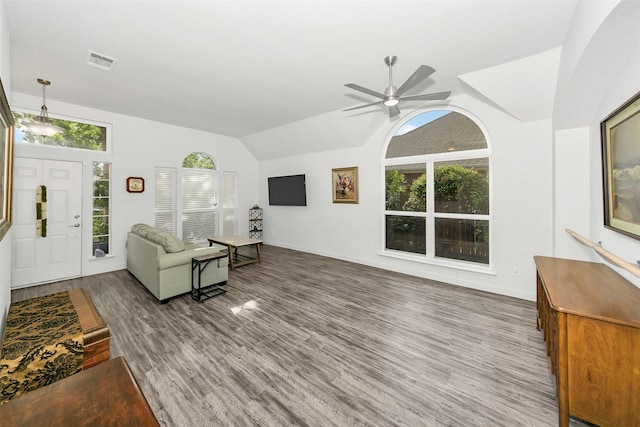 10110 Andre Dr, Irving, TX 75063 - living area featuring wood finished floors, visible vents, vaulted ceiling, ceiling fan, and baseboards