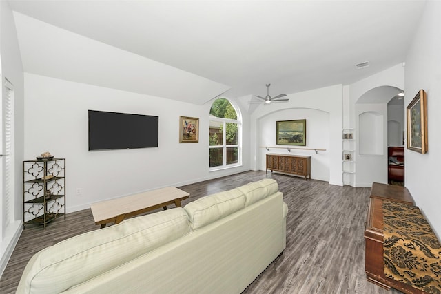 10110 Andre Dr, Irving, TX 75063 - living room featuring visible vents, a ceiling fan, dark wood-type flooring, and arched walkways