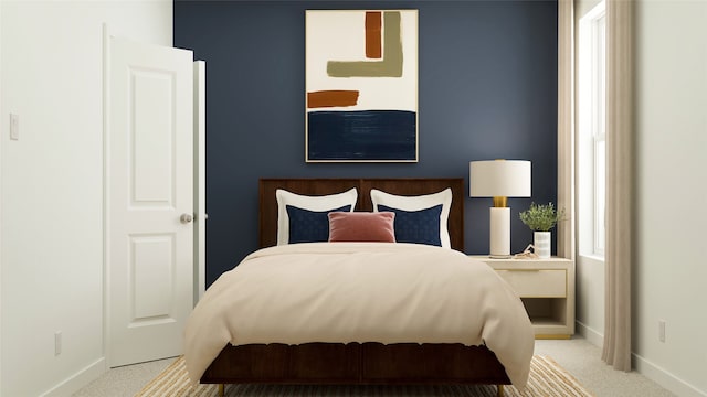 bedroom with baseboards and carpet floors
