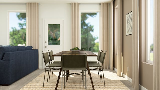 dining space featuring light wood-style flooring