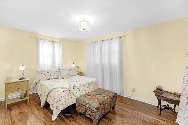 337 S Dobson St, Burleson, TX 76028 - bedroom featuring wood finished floors and baseboards