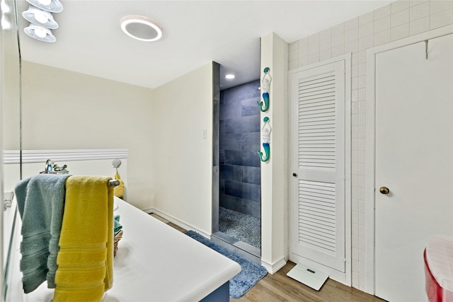337 S Dobson St, Burleson, TX 76028 - bathroom with walk in shower, wood finished floors, and baseboards
