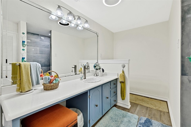 337 S Dobson St, Burleson, TX 76028 - full bathroom featuring wood finished floors, vanity, tiled shower, and baseboards