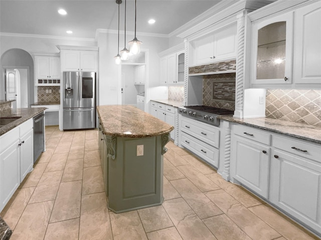 8280 St Johns Dr, Waxahachie, TX 75167 - kitchen with white cabinetry, ornamental molding, stainless steel appliances, and decorative backsplash