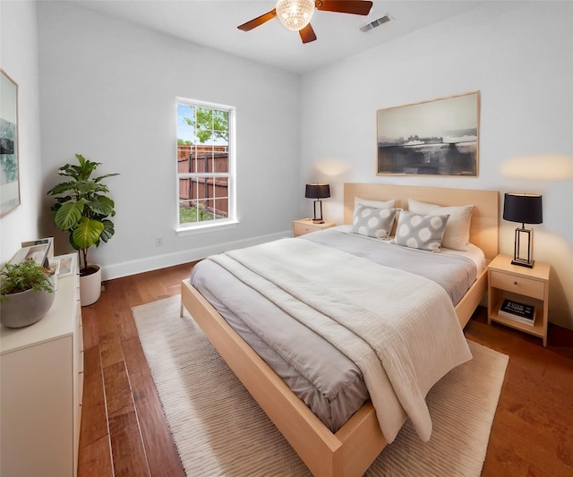 8280 St Johns Dr, Waxahachie, TX 75167 - bedroom featuring visible vents, wood finished floors, baseboards, and ceiling fan