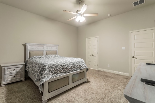bedroom featuring carpet, visible vents, baseboards, and ceiling fan