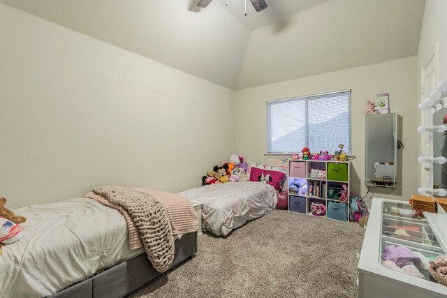 carpeted bedroom featuring vaulted ceiling and ceiling fan