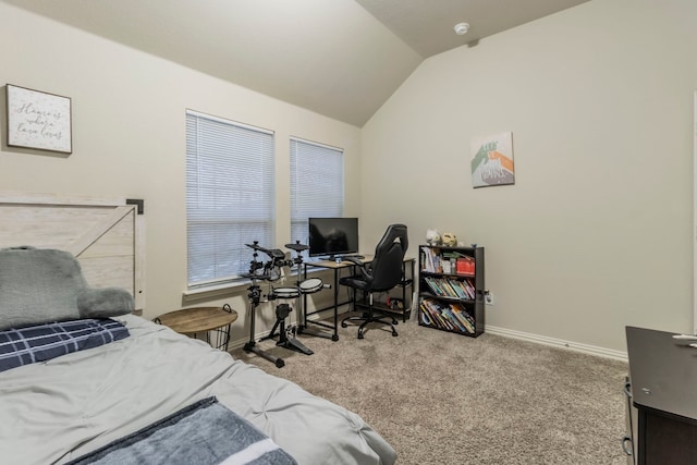 carpeted bedroom featuring lofted ceiling and baseboards