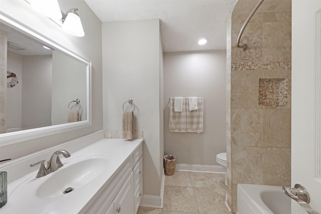 7340 Blackthorn Dr, Fort Worth, TX 76137 - bathroom featuring toilet, vanity, tile patterned flooring, baseboards, and a textured ceiling