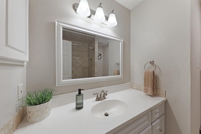 7340 Blackthorn Dr, Fort Worth, TX 76137 - full bath with vanity, a shower, and a textured wall