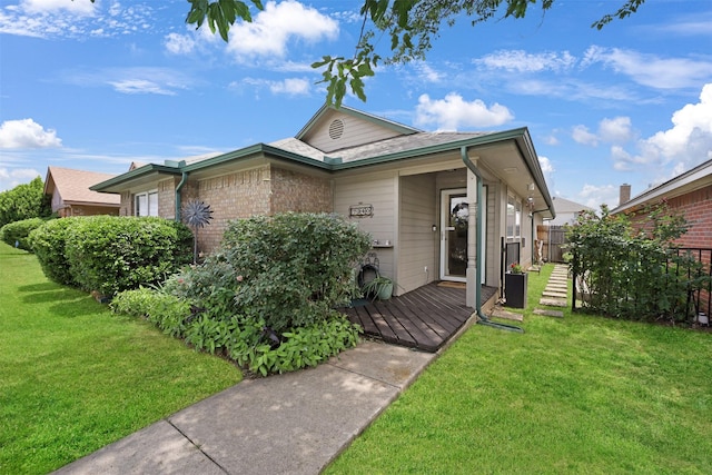 7340 Blackthorn Dr, Fort Worth, TX 76137 - view of front facade with a front yard and brick siding