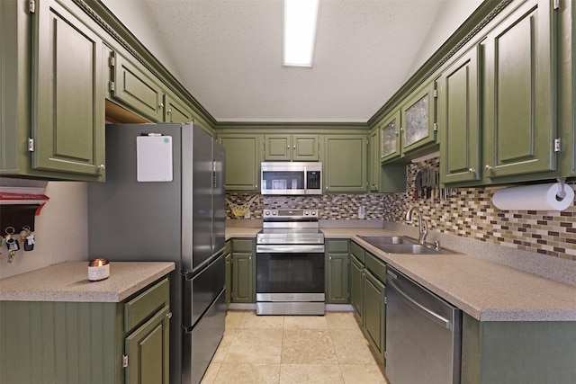 7340 Blackthorn Dr, Fort Worth, TX 76137 - kitchen featuring appliances with stainless steel finishes, a sink, backsplash, and light countertops