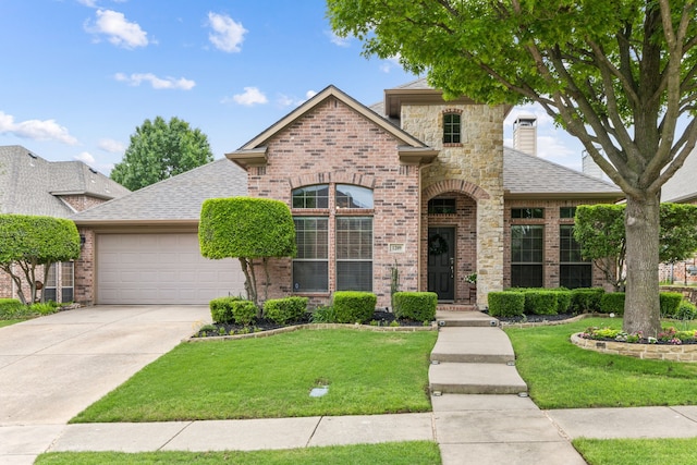 view of front of property with driveway, brick siding, an attached garage, roof with shingles, and a front lawn