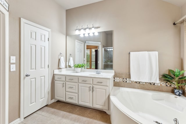 bathroom with vanity, a shower stall, a bath, and tile patterned floors