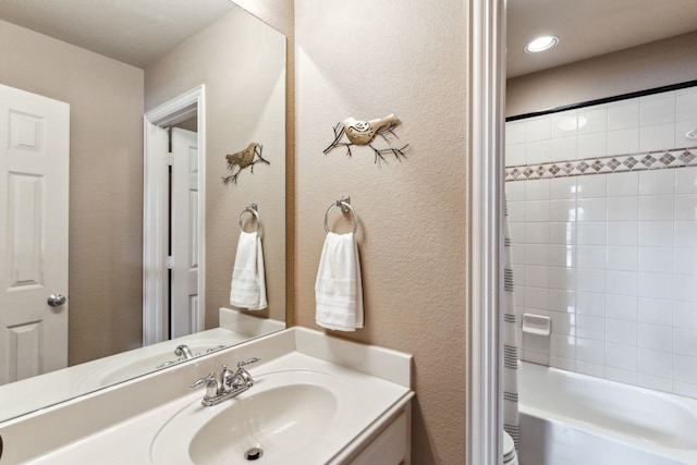 full bathroom featuring vanity, shower / tub combo with curtain, and toilet
