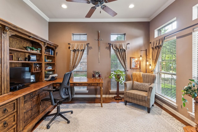 home office with ceiling fan, ornamental molding, baseboards, and wood finished floors