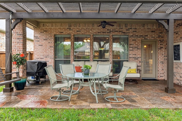 view of patio / terrace with a pergola, ceiling fan, area for grilling, and outdoor dining area