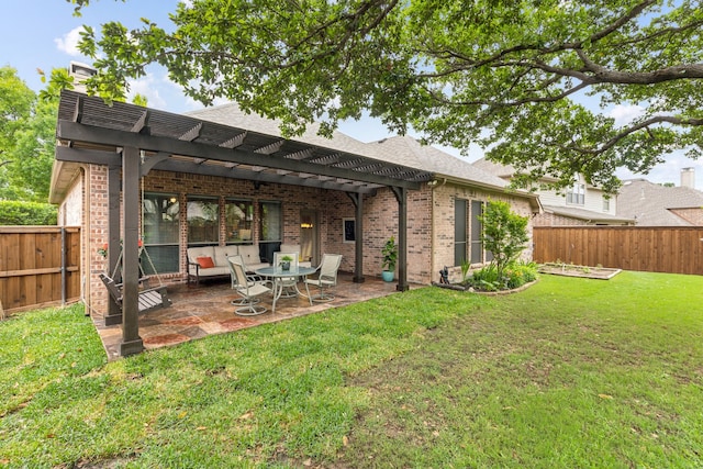 exterior space featuring a yard, brick siding, a patio, a pergola, and a fenced backyard