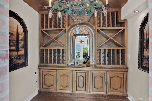 5705 Shoreline Dr, Shreveport, LA 71119 - wine area with baseboards and arched walkways