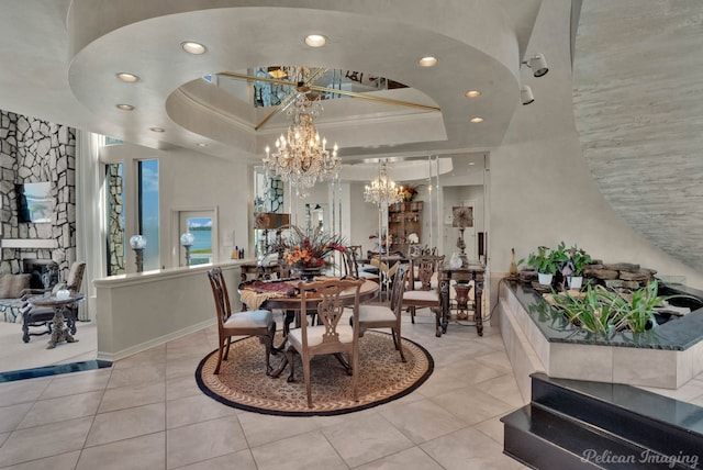 5705 Shoreline Dr, Shreveport, LA 71119 - tiled dining area with ornamental molding, a tray ceiling, recessed lighting, and a chandelier
