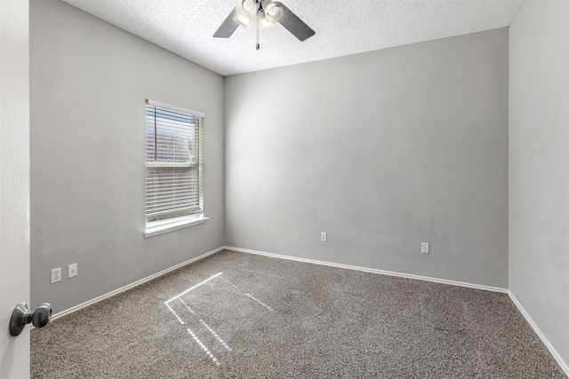 spare room featuring a textured ceiling, baseboards, a ceiling fan, and carpet floors