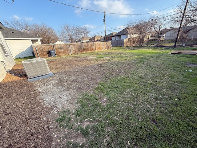 view of yard with fence and cooling unit