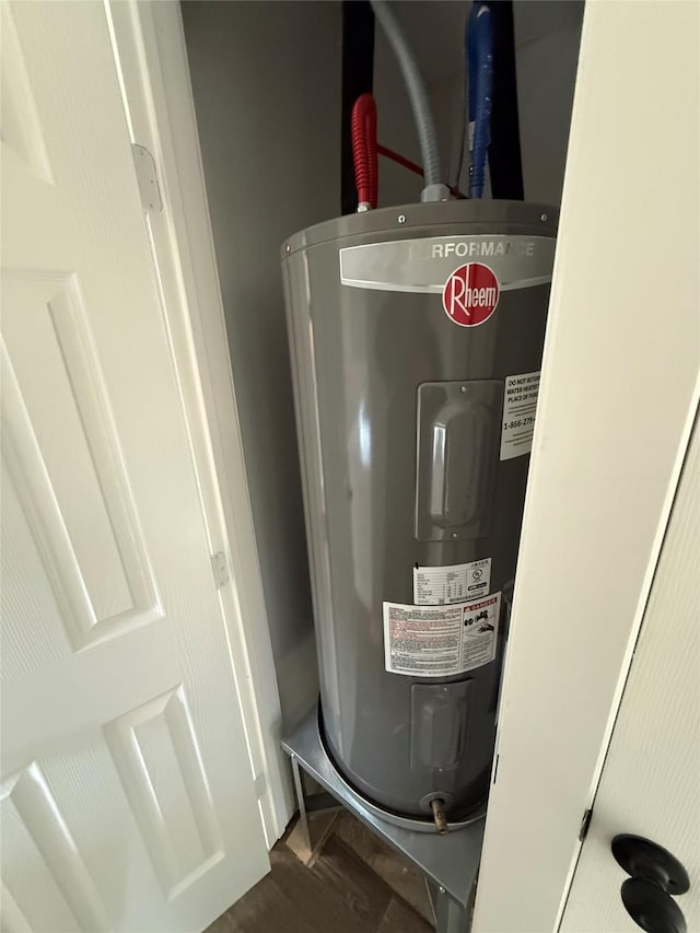 utility room with electric water heater