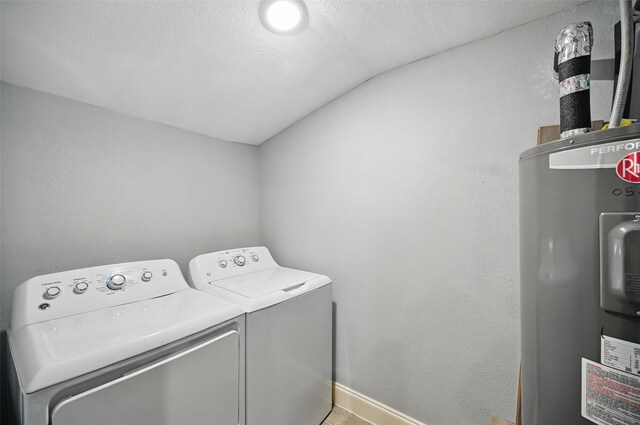 11519 Desdemona Dr, Dallas, TX 75228 - laundry room with independent washer and dryer, water heater, baseboards, and a textured ceiling