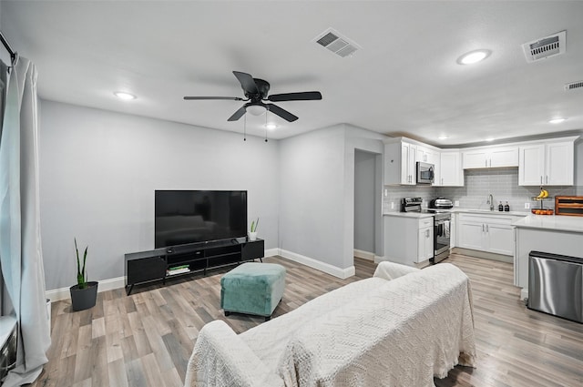 11519 Desdemona Dr, Dallas, TX 75228 - living area featuring baseboards, recessed lighting, ceiling fan, and light wood finished floors