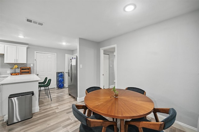 11519 Desdemona Dr, Dallas, TX 75228 - dining room featuring baseboards, light wood-style floors, and recessed lighting