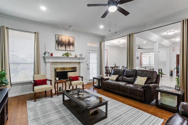 3811 Maywood Dr, Carrollton, TX 75007 - living area with a ceiling fan, a fireplace, wood finished floors, ornamental molding, and baseboards
