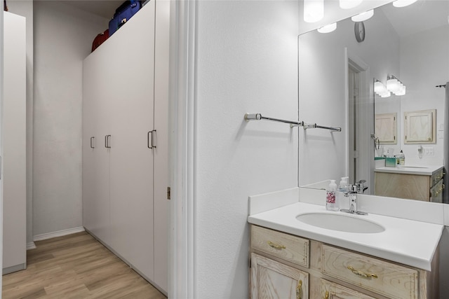 3811 Maywood Dr, Carrollton, TX 75007 - bathroom with wood finished floors and vanity