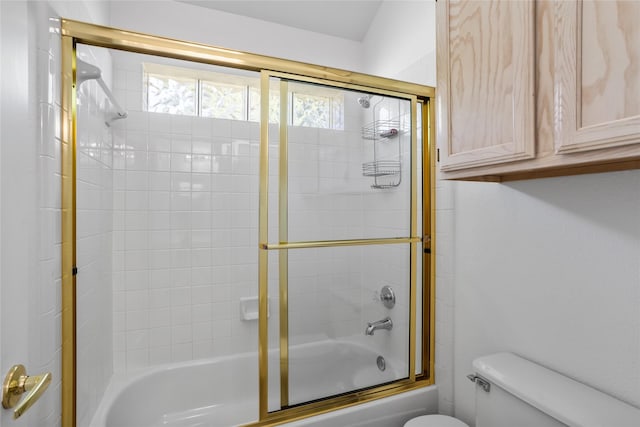 3811 Maywood Dr, Carrollton, TX 75007 - bathroom featuring toilet and shower / bath combination with glass door