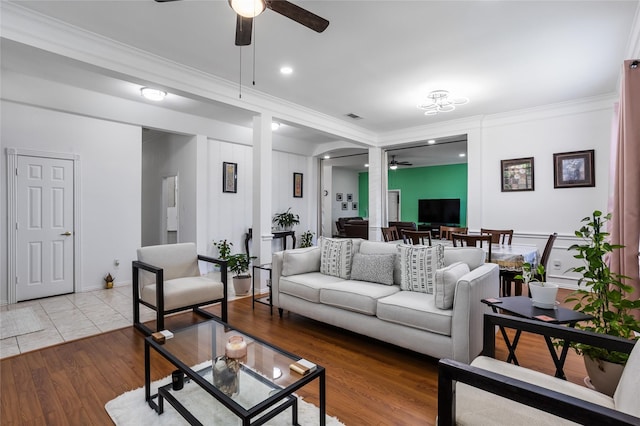 3811 Maywood Dr, Carrollton, TX 75007 - living area with a ceiling fan, ornamental molding, wood finished floors, and decorative columns