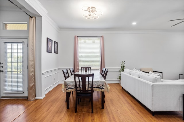 3811 Maywood Dr, Carrollton, TX 75007 - dining space featuring ornamental molding, light wood-style floors, and wainscoting