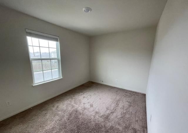 11757 Davalos Ln, San Antonio, TX 78252 - carpeted empty room featuring baseboards