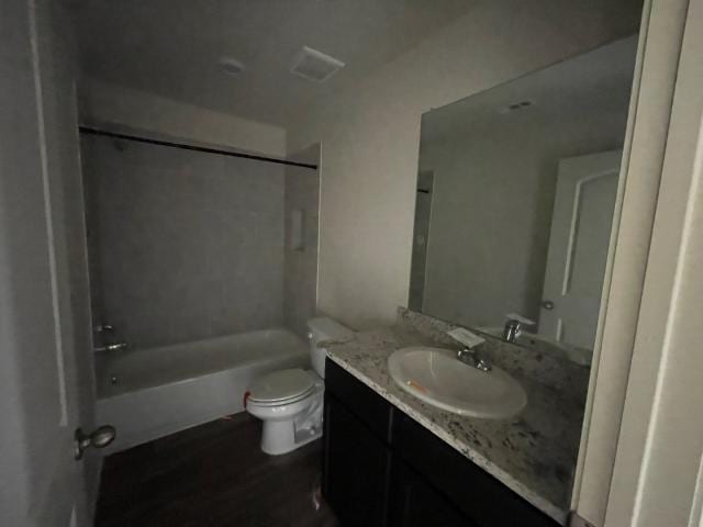 11757 Davalos Ln, San Antonio, TX 78252 - bathroom featuring toilet, vanity, and shower / tub combination