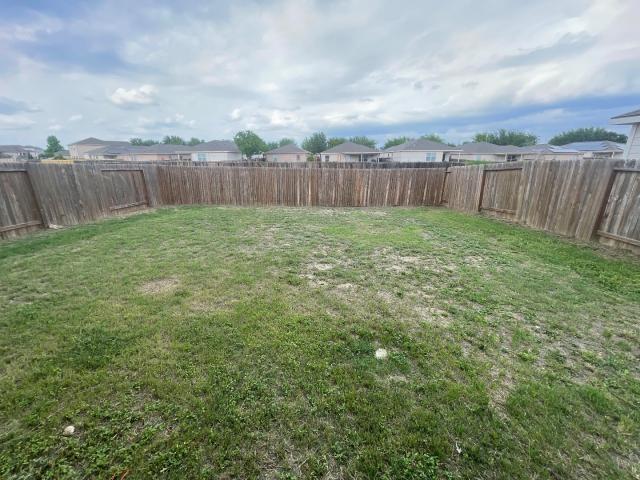 11757 Davalos Ln, San Antonio, TX 78252 - view of yard featuring a fenced backyard