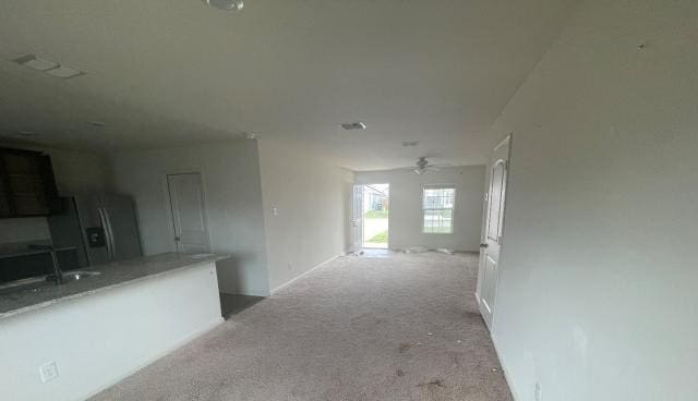 11757 Davalos Ln, San Antonio, TX 78252 - corridor featuring baseboards, light carpet, and a sink