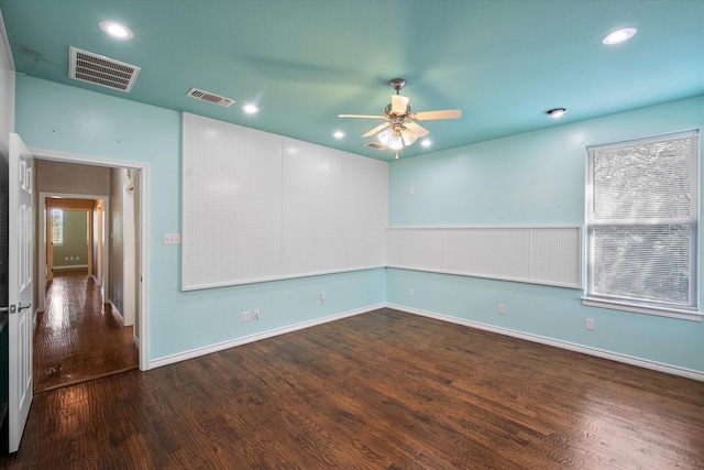 empty room featuring visible vents, wood finished floors, a ceiling fan, and recessed lighting