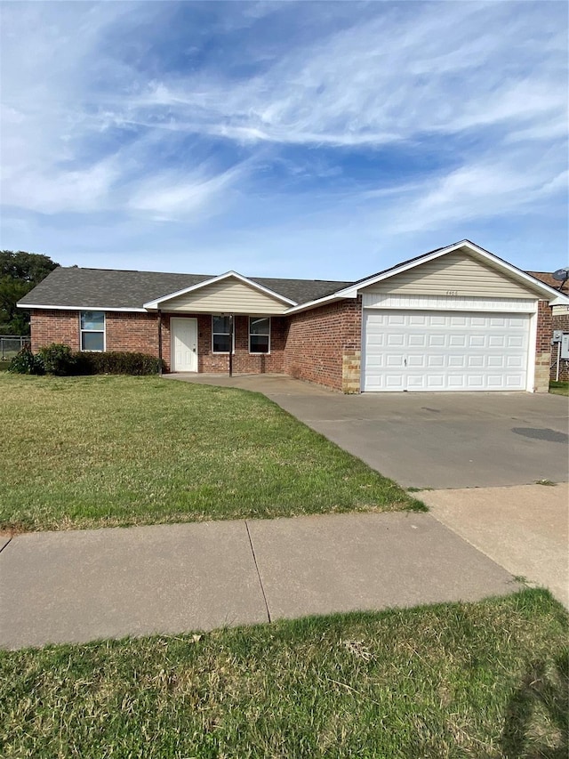 4406 Bobbie Ann Dr, Granbury, TX 76049 - ranch-style home featuring concrete driveway, a front lawn, brick siding, and an attached garage