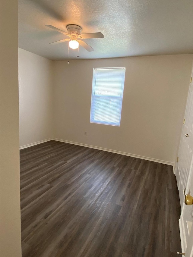 4406 Bobbie Ann Dr, Granbury, TX 76049 - unfurnished room featuring a ceiling fan, baseboards, dark wood finished floors, and a textured ceiling
